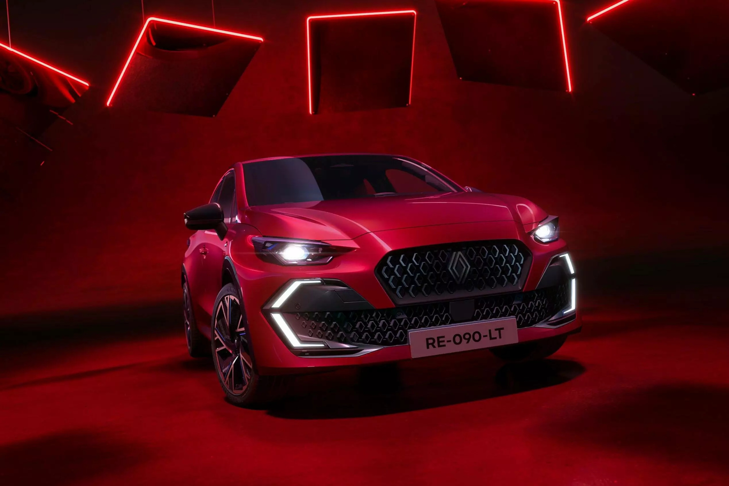 nuova renault clio rosso fuoco con dettaglio dei fari e della mascherina anteriore 